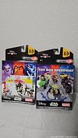 Photo showing two sealed Disney Infinity 3.0 Toy Box Expansion Games: Toy Box Takeover and Toy Box Speedway
