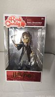 Front view of the new in box Hermione Granger RockCandy vinyl collectible in original packaging showing figure and branding.