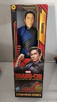 Photo of the Wenwu action figure in its original packaging, showing front side with character art and branding.