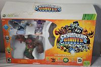 Original retail packaging showing three Skylanders Giants figures visible through window. Box labeled Xbox 360 and Skylanders Giants Starter Pack.