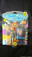 Full view of sealed Star Trek Next Generation Commander Sela action figure in original blister card packaging, showing front artwork and text.