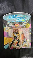 Clear photo of the new in box Lieutenant Worf action figure from Star Trek The Next Generation, showing package details and included accessories.