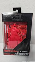 Front view of Star Wars Black Series Emperor's Royal Guard figure in its original packaging showing figure, accessories, and Star Wars branding.