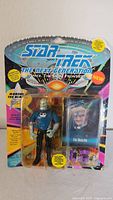 Front of vintage Star Trek Mordock figure packaging showing figure and accessories inside blister pack with colorful graphics and branding.