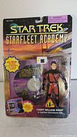 Front view of unopened vintage Star Trek Starfleet Academy Cadet William Riker action figure in original blister card packaging showing figure in Geo-Hazard suit and included Starfleet Academy CD-ROM.