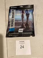 Front view of the PowerLix knee brace packaged, showing branding and features including unisex label.