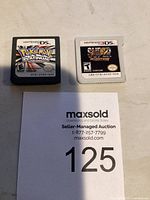 Nintendo DS Pokémon Platinum and Nintendo 3DS Street Fighter IV 3D Edition cartridges side by side.