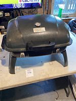 Front view of the black Everyday Essentials table top grill on a table.