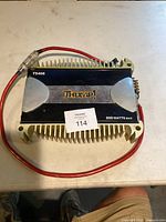 Full top view of Thump amplifier showing logo and model number T5406 with 800 watts max power specification.