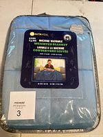 Packaged Altavida weighted blanket showing brand, weight, and dimensions.