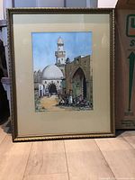 Full view of the framed watercolor painting depicting a Middle Eastern street scene with a dome, minaret, and people in traditional dress.