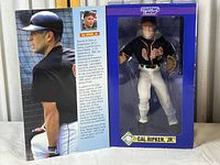 Boxed Cal Ripken Jr. figurine showing front and side of packaging including player info and photo.