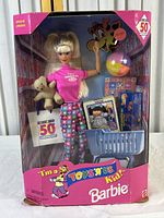 Full view of boxed Barbie 50th Edition Toys 'R' Us Collectible Doll with accessories.
