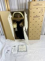 Doll and packaging box, showing main box with "Diana Princess of Wales" labeling and contents including doll limbs and certification documents.
