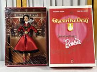 Front view of the Barbie doll in the original box along with the box cover showing branding and series.