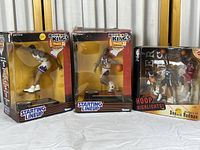 Photo showing all three NBA action figures in their original packaging: Karl Malone, Amare Stoudemire (Starting Lineup Backboard Kings by Kenner) and Dennis Rodman (Hoop Highlights by Mattel).
