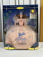 Full front view of the Mattel Glinda Barbie doll in collector edition box, showing packaging and doll details.
