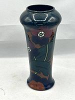 Front view of the vase showing the full floral design and body shape.