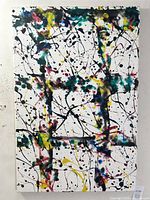 Front view of the vibrant large abstract acrylic painting with layered splashes and drips in multiple colors on white canvas.