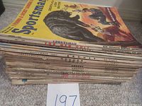 Stack of magazines showing spine titles and dates of multiple issues including Sportsman for Men Only July 1957 on top