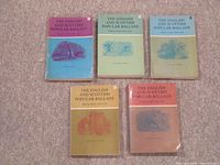 Front covers of the 5 volume set with pastel dust jackets in purple, green, light blue, yellow, and orange.