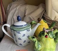 Three vintage tea pots including porcelain Villeroy & Boch and two Stokes ceramic decorative pots.