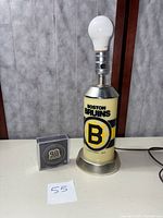 Photo of a vintage Boston Bruins branded lamp with LED bulb, item displayed standing on a flat surface.