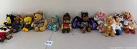 Full lot of 11 Disney and Warner Bros. plush toys.