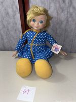 Front view of Mrs. Beasley doll showing face and dress with original tag.
