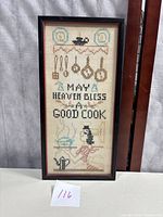 Full framed cross stitch showing all elements including text and kitchen utensils.
