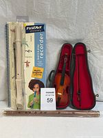 Photo showing three musical instruments: sealed First Act Discovery Learn & Play recorder kit with book and plastic recorder, a small child-size violin with bow in red-padded hard case, and a wooden flute.