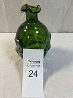 Front view of mid-century emerald green art glass vase with applied clear glass accents and ruffled rim