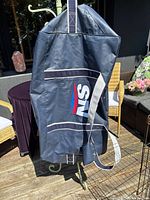 Front view of the navy blue SN hockey equipment bag with SN logo and shoulder strap displayed.