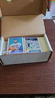 Open box showing Nolan Ryan cards on left end
