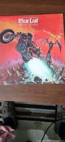 Front sleeve artwork showing motorcycle scene and Meat Loaf album title