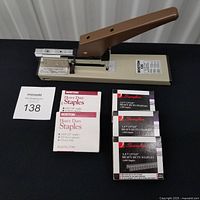 Boston 135 stapler with five boxes of staples displayed on table