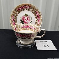Cup standing in front of saucer displaying full pattern and number card 93