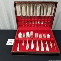 Open case showing full 40-piece Patrician flatware set
