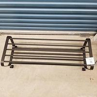 Full view of metal shoe rack front profile