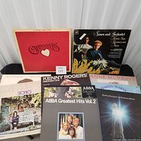 Group shot of records showing Carpenters, Simon & Garfunkel, ABBA, Kenny Rogers and others