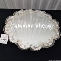 Full view of mirrored vanity tray with scalloped glass border