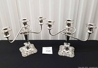 Full view of both matching silver plated candelabra