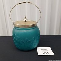Full view of satin glass biscuit barrel with lid and handle