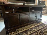 Front view showing full cabinet, open shelving, and closed doors