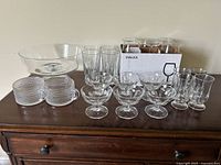 Overview of all glassware items including punch bowl, cups, stemmed glasses, tall tumblers and boxed SVÄLKA glasses