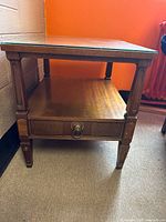 Front and side view of the wooden end table showing drawer and leg details.