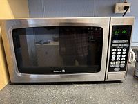Front view of Kuraidori microwave showing door and general stainless steel exterior