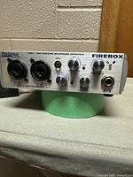 Front view of PreSonus Firebox showing dual combo XLR/TRS inputs, gain controls, phantom power button, headphone jack, and main level control.