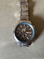 Front view of Silpada stainless steel watch with subdials on face and link band.