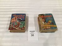 Both Better Little Books side by side with lot number visible